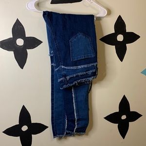 Distressed patchwork jeans